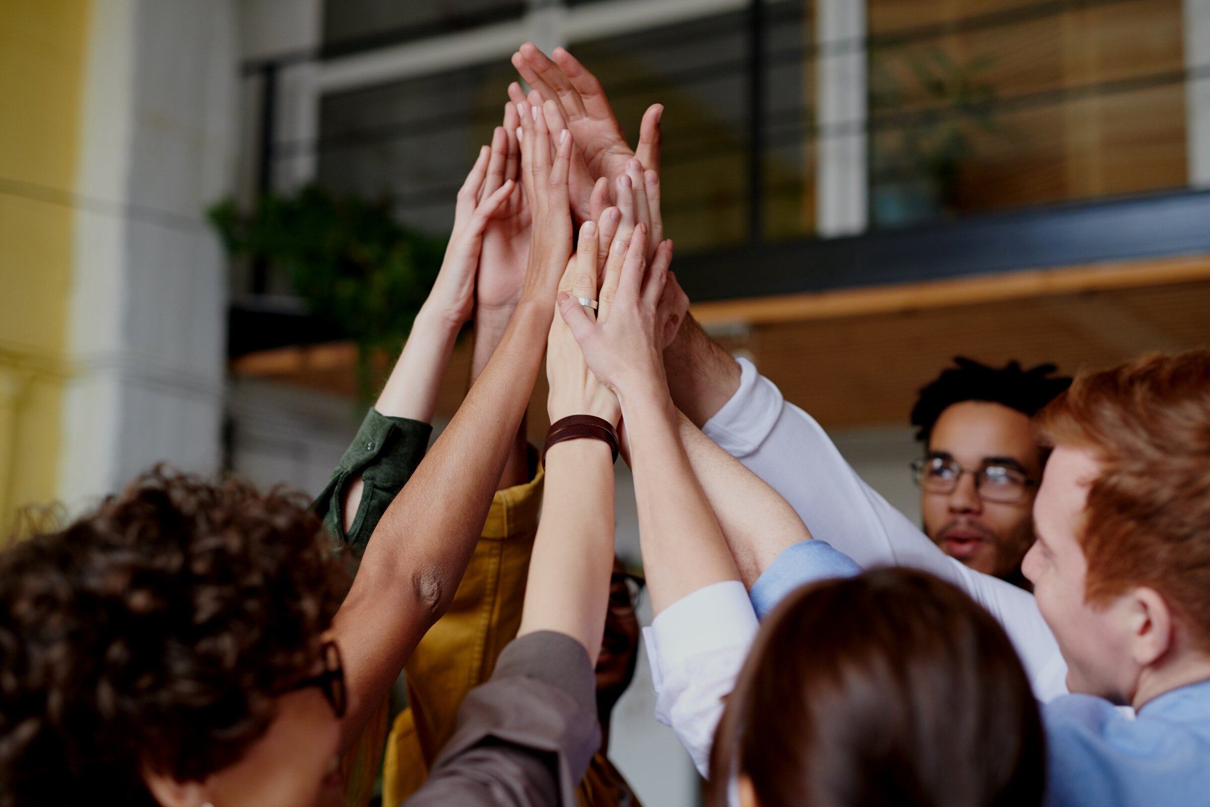 Photo Of People Touching Each Other's Hands